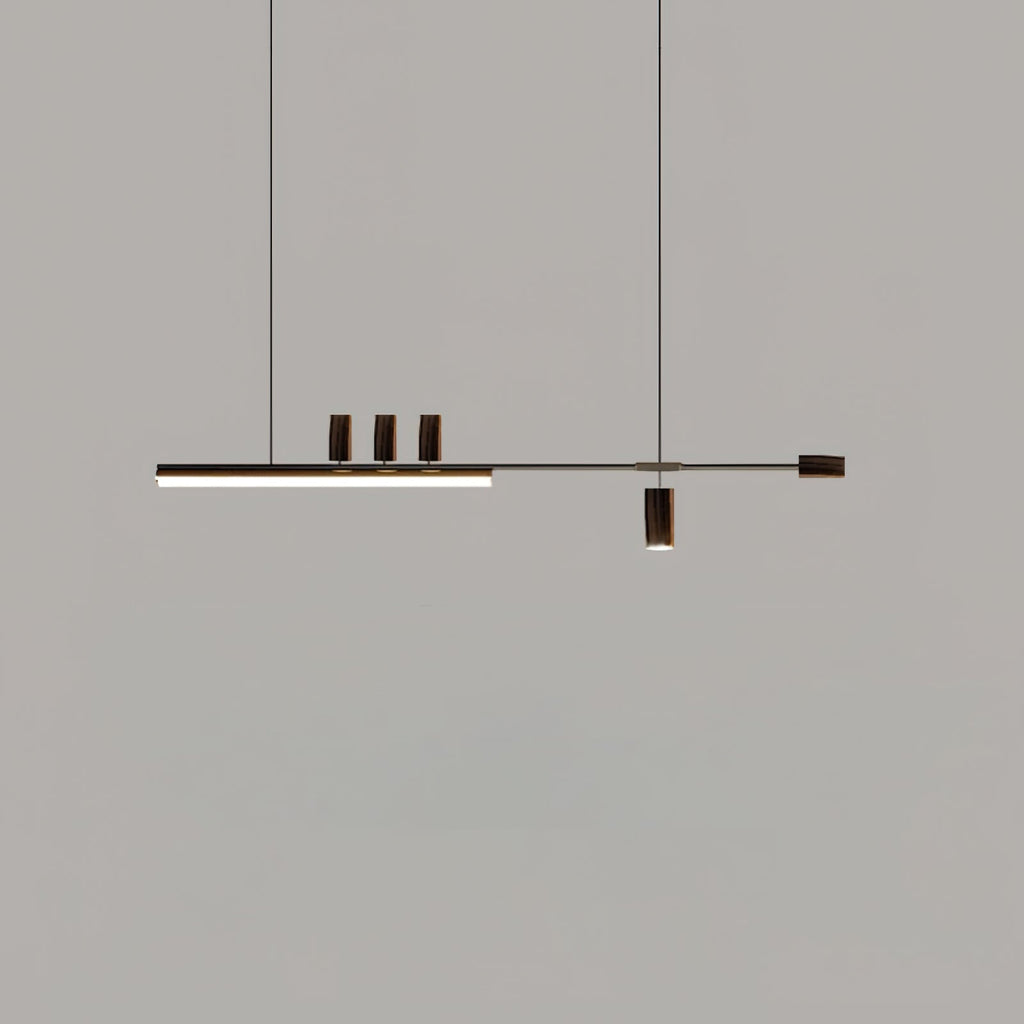 Another dark-toned view of this Clérachic pendant on grey, with the bar lit and the top cylinders and end cap in deep brown.