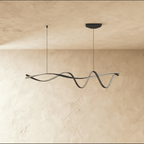 Clérachic black ribbon pendant switched off, its twisting aluminium band and silver-grey inner face hanging from two cords.