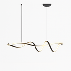 Clérachic twisting ribbon pendant lit in warm white, its black band curling in loops beneath a rounded ceiling plate on white.