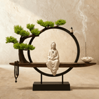 Clérachic incense-burner lamp with a seated white Guanyin figure, bonsai tree and prayer beads on a wood base.