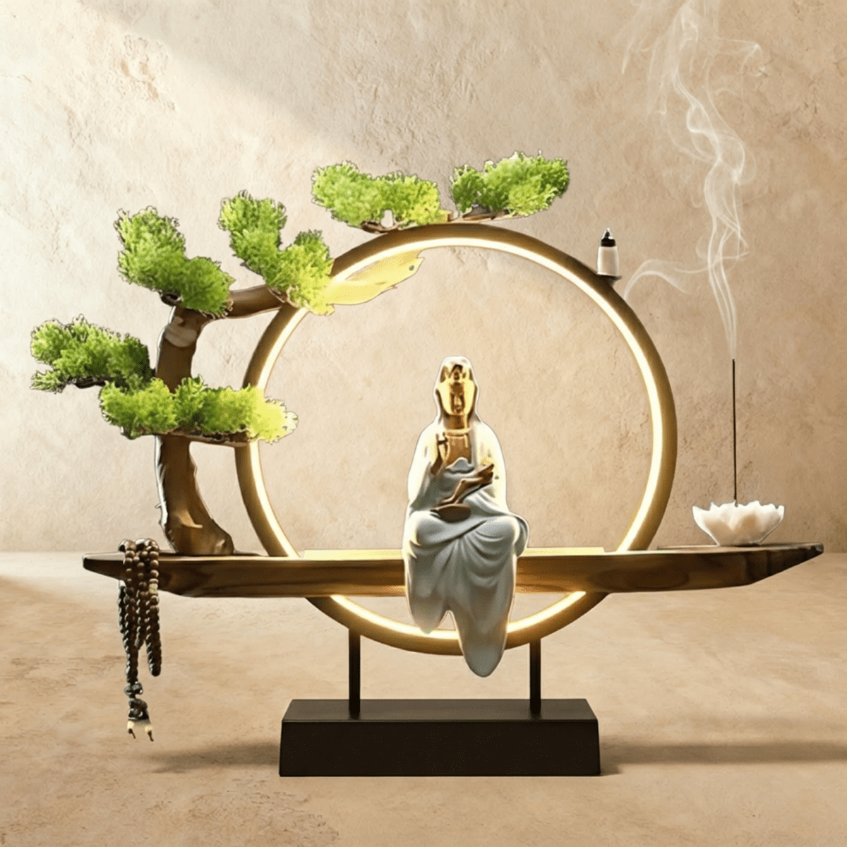 Clérachic incense-burner lamp lit bright gold, a seated white and gold Guanyin figure glowing within the ring.