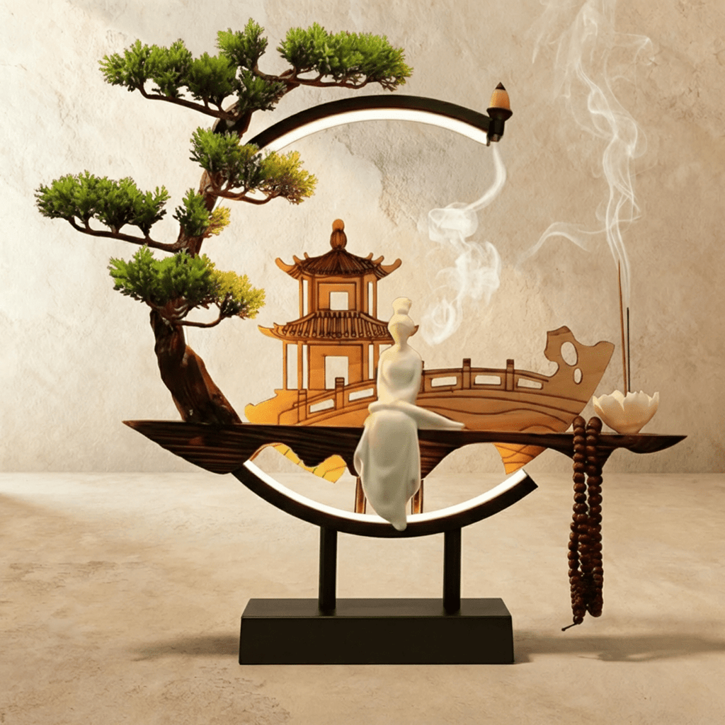 Clérachic incense-burner lamp, a standing white figure and pagoda inside a ring lit only along its base.