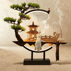 Clérachic incense-burner lamp, a standing white figure and pagoda inside a ring lit only along its base.