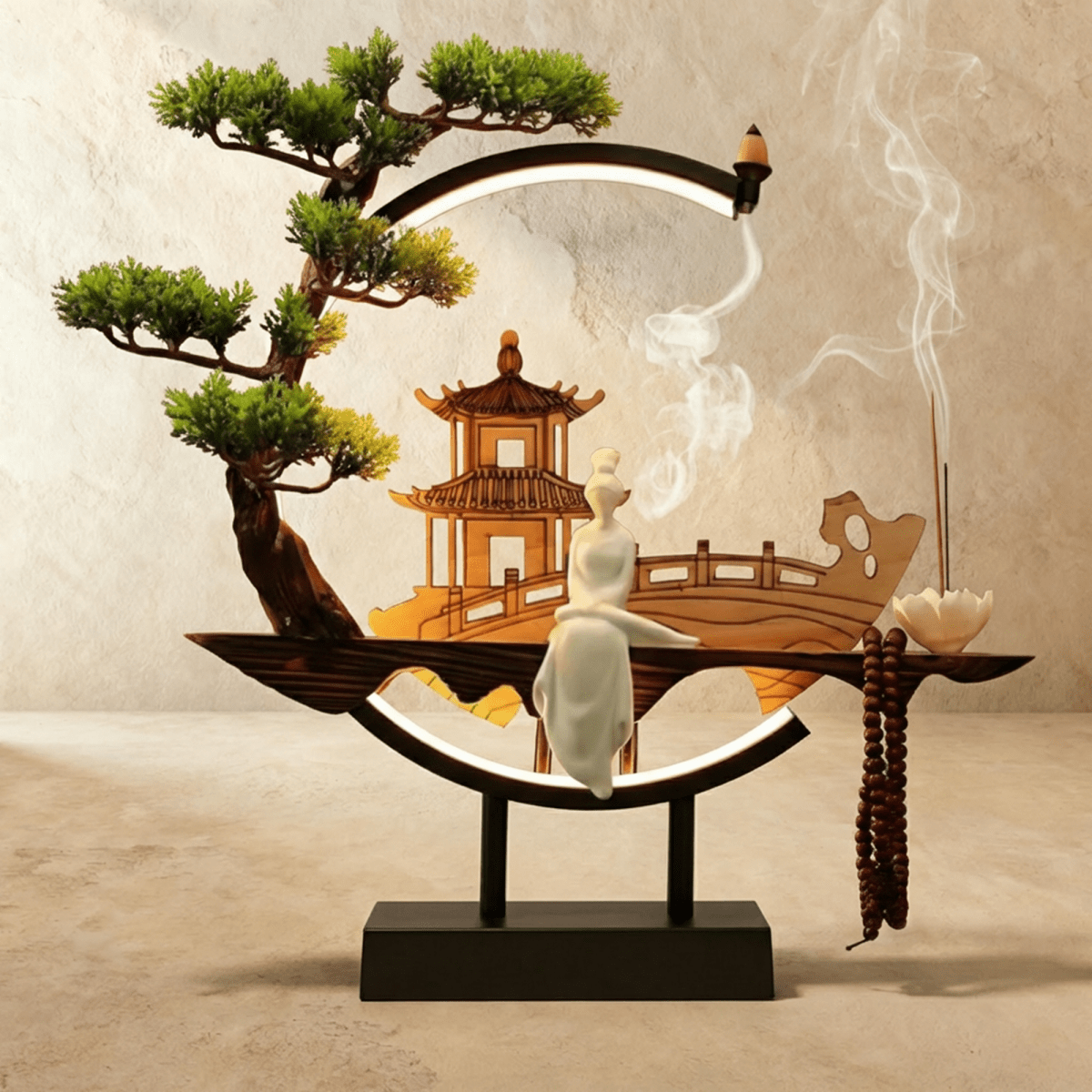 Clérachic incense-burner lamp, a standing white figure and pagoda inside a ring lit only along its base.