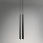 Four black tapered tubes hang at two different drops against a soft grey wall, each tip lit, a Clérachic pendant.