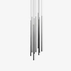 Staggered black tube pendants with fine cords on a near-white background, shown unlit, a Clérachic pendant.