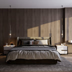 Two black-tinted pendants flank a wood-panelled bedroom wall, hanging unlit above matching bedside cabinets, Clérachic lifestyle shot.