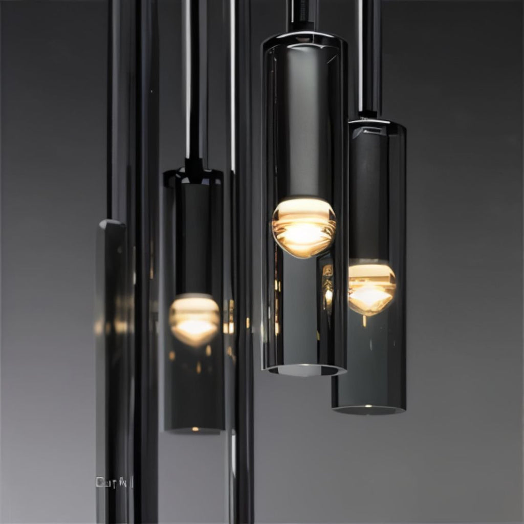 A cluster of black-tinted glass pendants glows warm in close-up against a dark gradient backdrop, Clérachic detail shot.