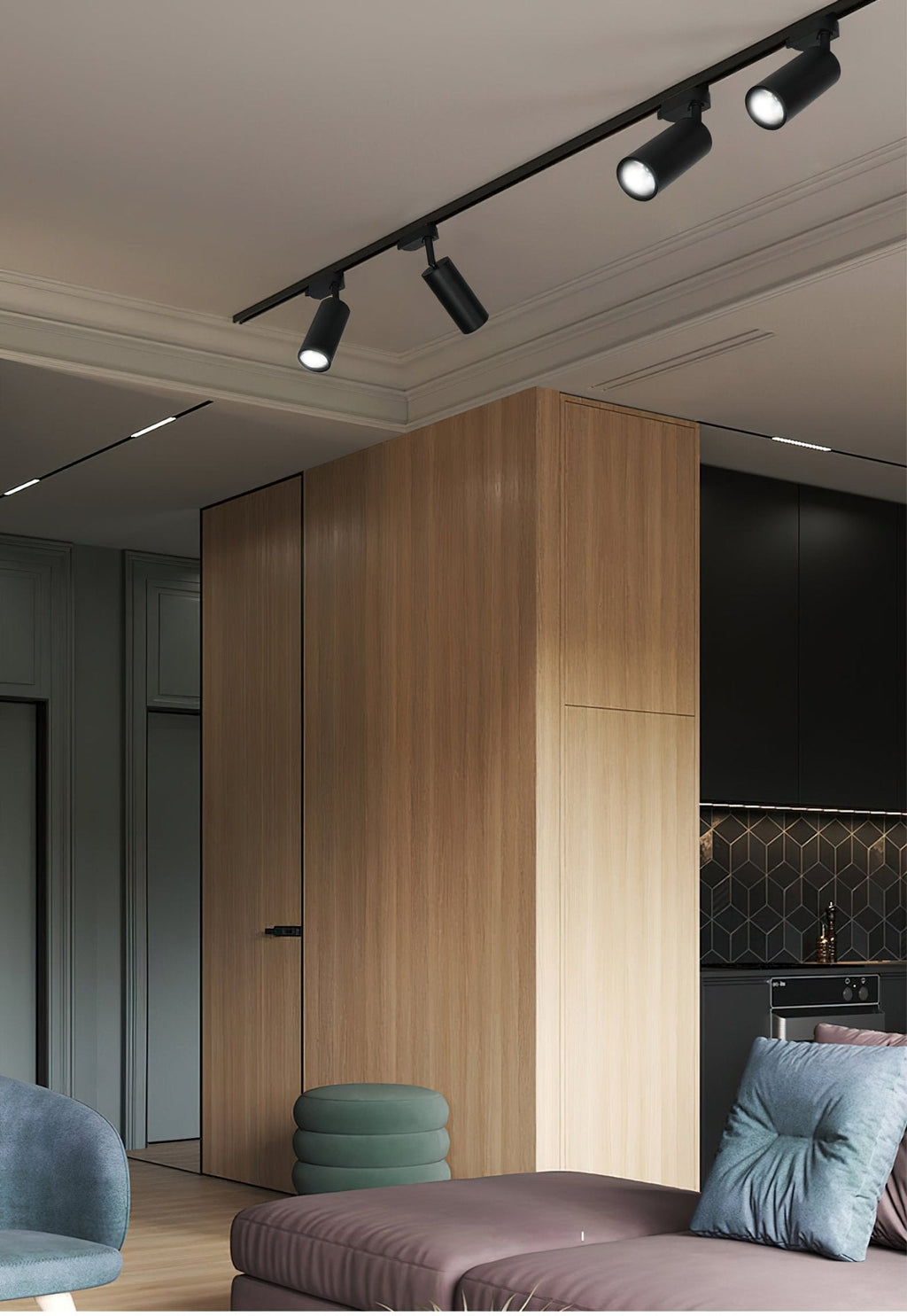 Clérachic black track with several spotlight heads on a ceiling above a timber-clad column and a mauve sofa.