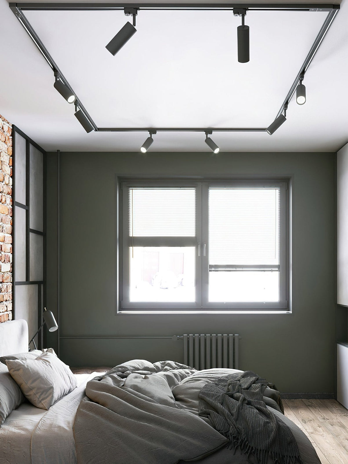 Clérachic track light with black spotlight heads on a rectangular track around a bedroom ceiling, above a grey bed.