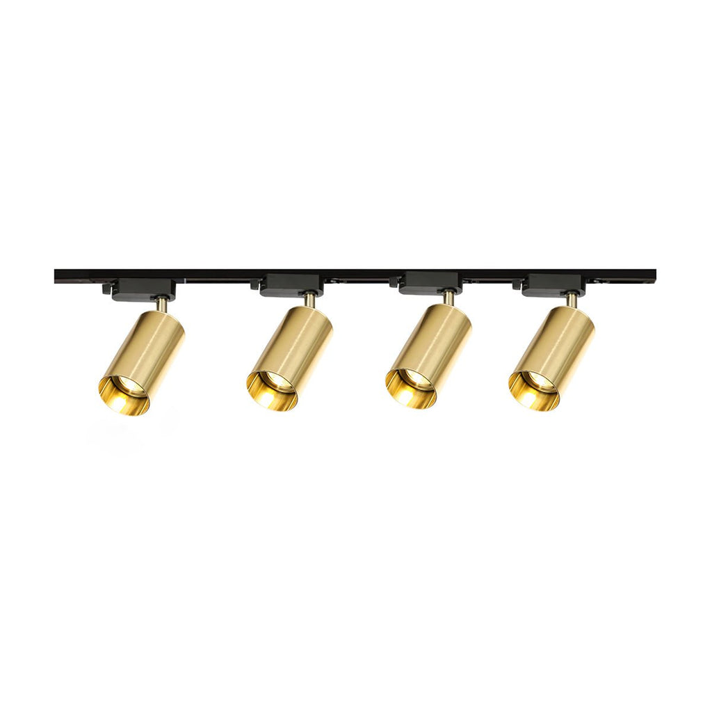Four gold cylindrical spotlights on a straight black Clérachic track, shown on a plain white background.