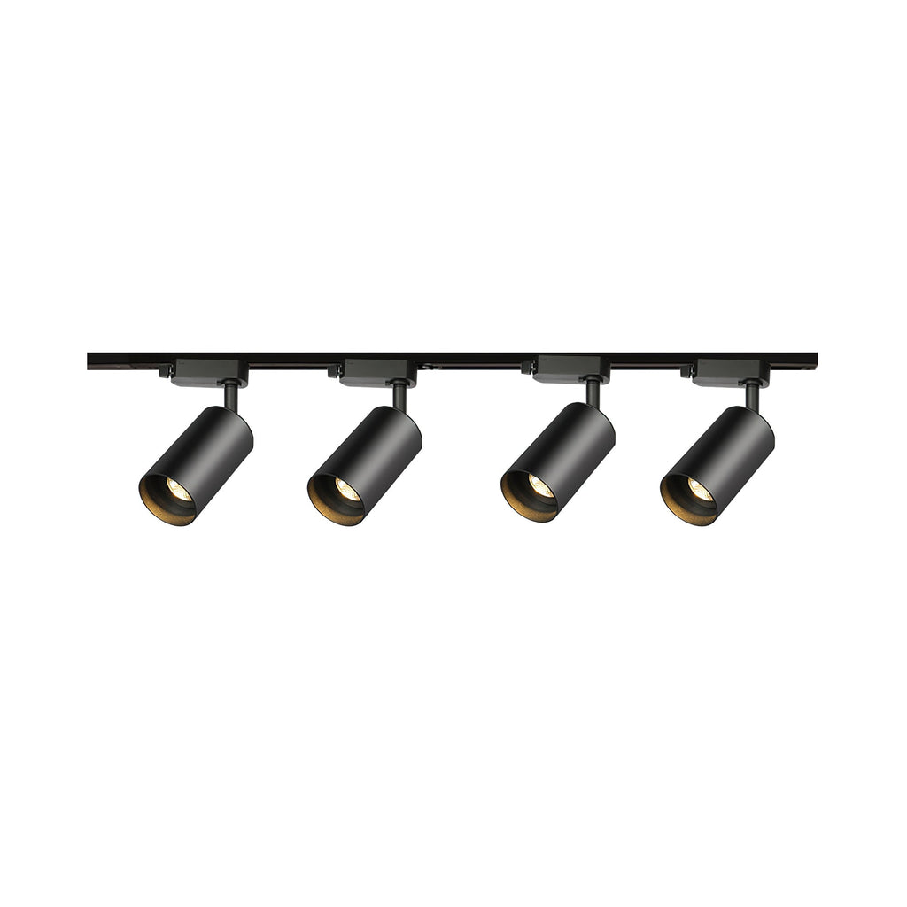 Four black cylindrical spotlight heads on a straight black Clérachic track, on a white background.