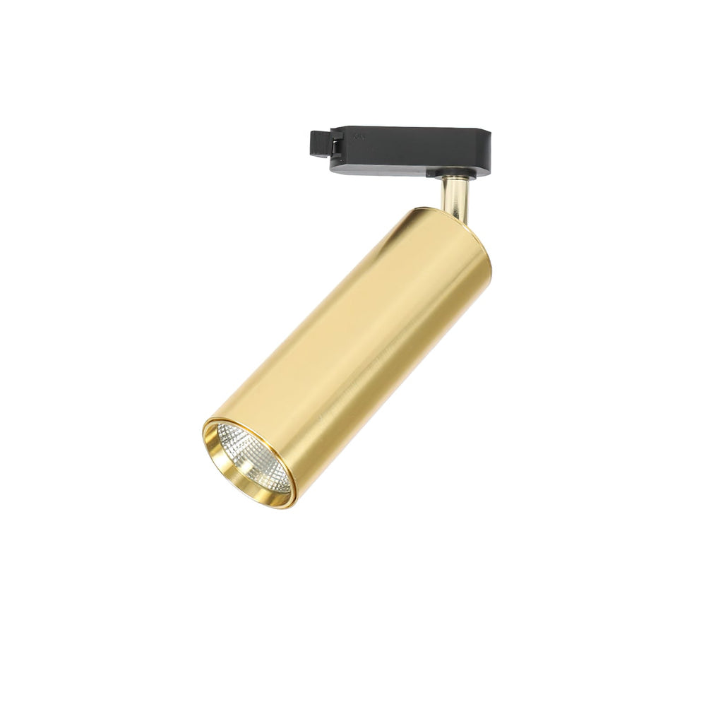 A gold cylindrical Clérachic track spotlight with a black adaptor, tilted to show the recessed lens, on white.