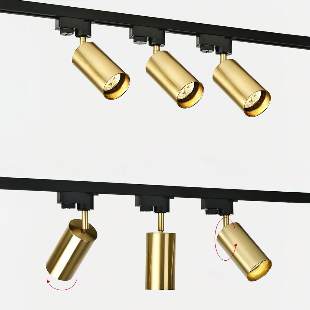 Close views of gold Clérachic spotlight heads on a black track, with red arrows showing how each one tilts and turns.
