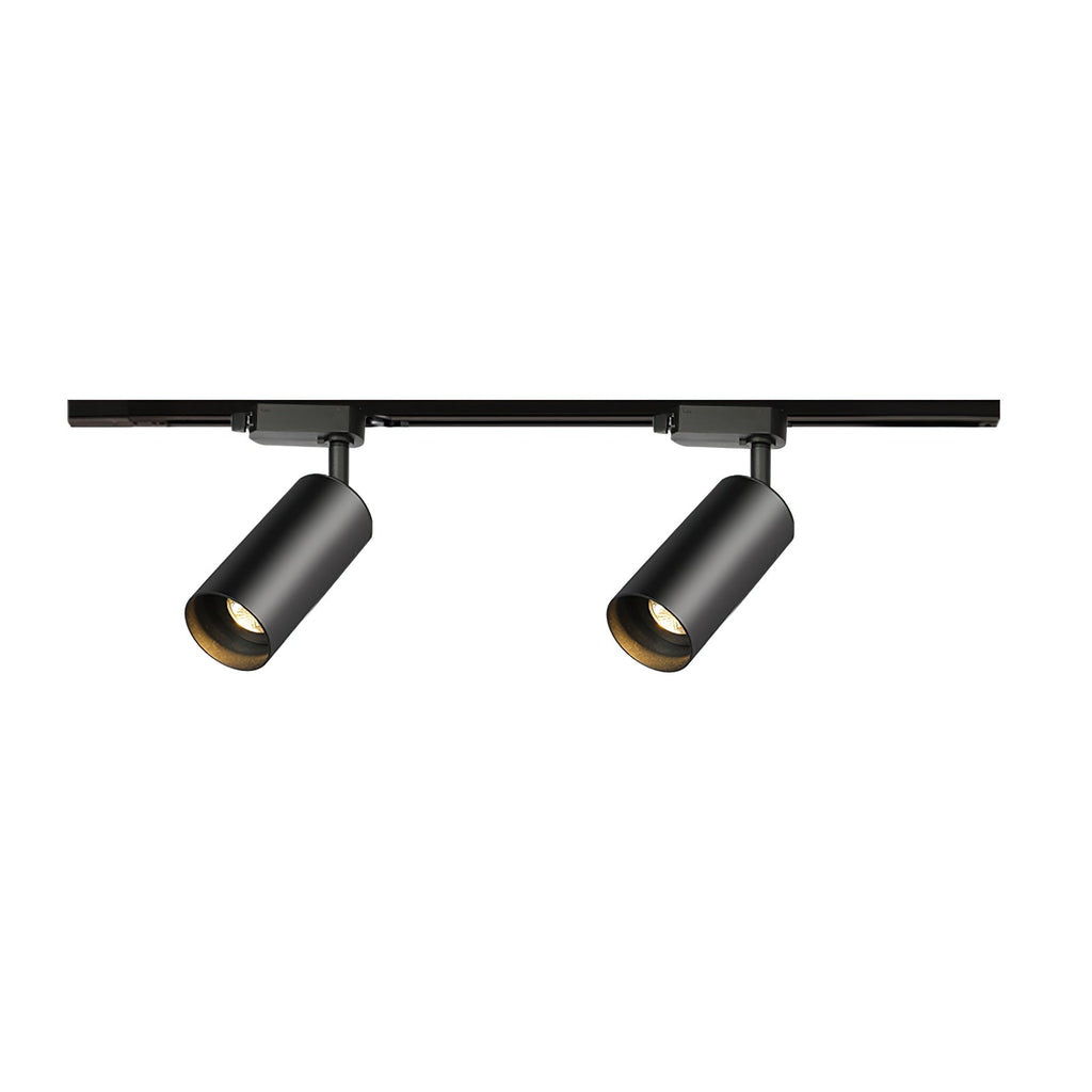 Two black cylindrical Clérachic spotlights on a straight black track, shown on a plain white background.