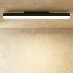 Clérachic extra-long black linear floodlight fixture spanning a ceiling track, lit along its full frosted face.