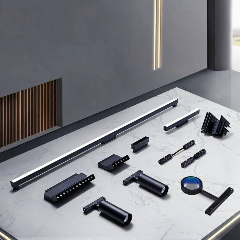 Clérachic track lighting components laid out together, showing rail, spotlight heads, ball lamp and connectors.