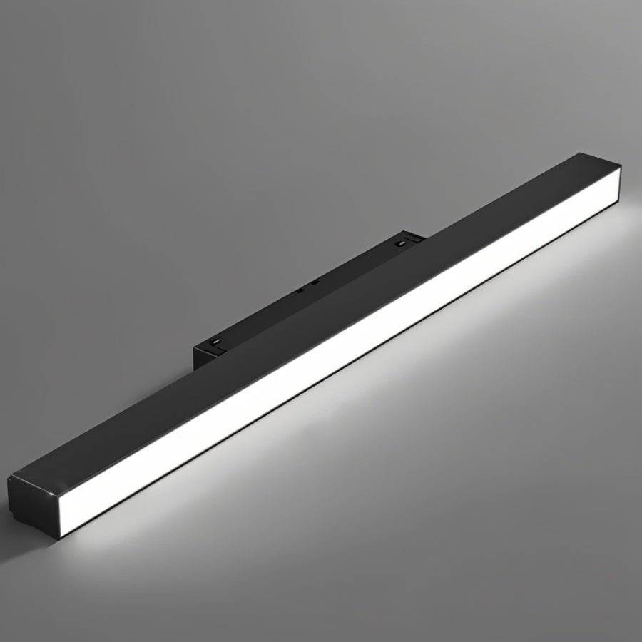 Clérachic slim black linear floodlight bar shown close against grey, its frosted diffuser lit edge to edge.