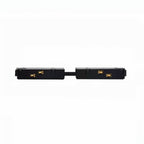 Clérachic black track rail connector bridge with gold contact pins, shown joining two sections end to end.