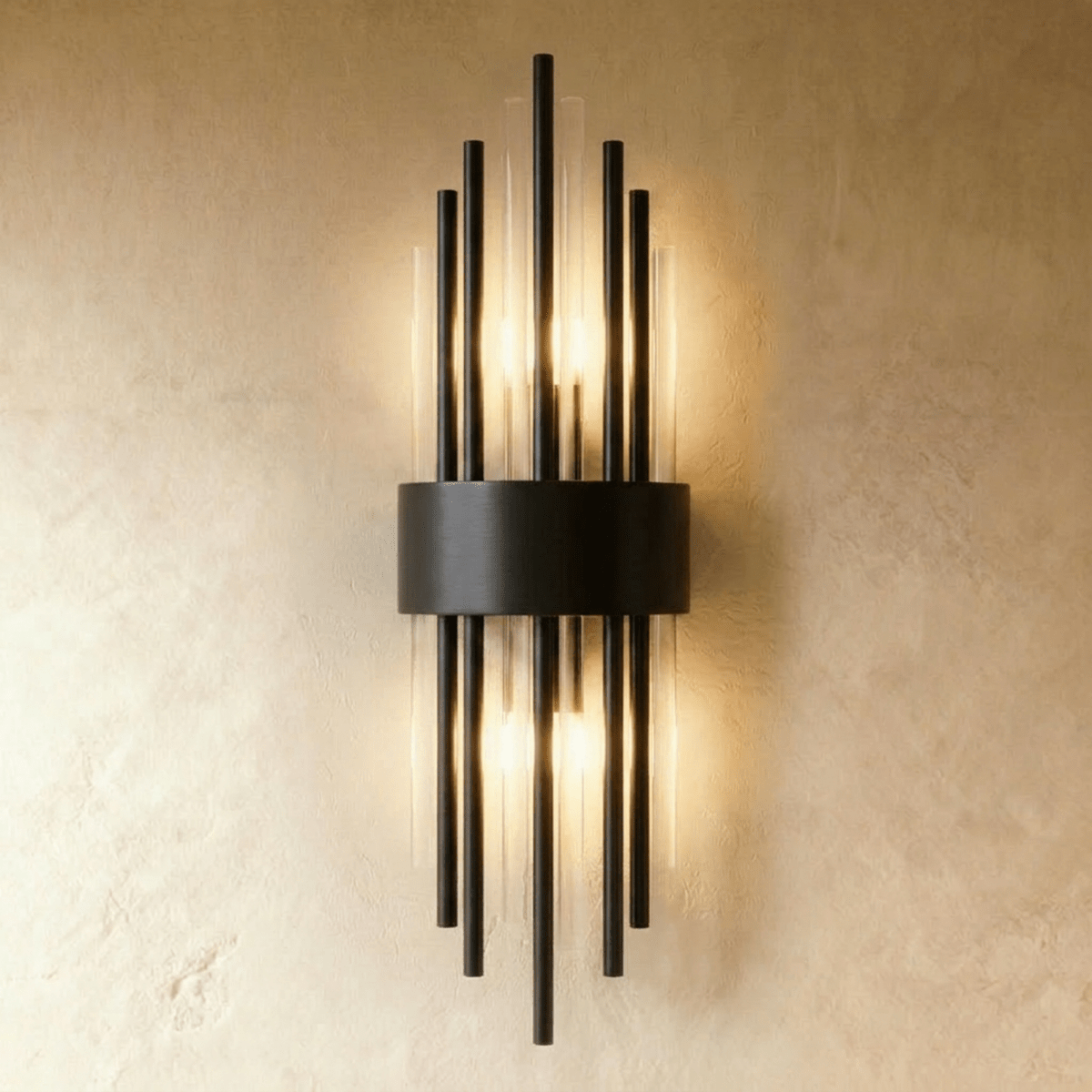 Clérachic black metal wall sconce with tall fluted glass rods fanning from a curved backplate on a plaster wall.
