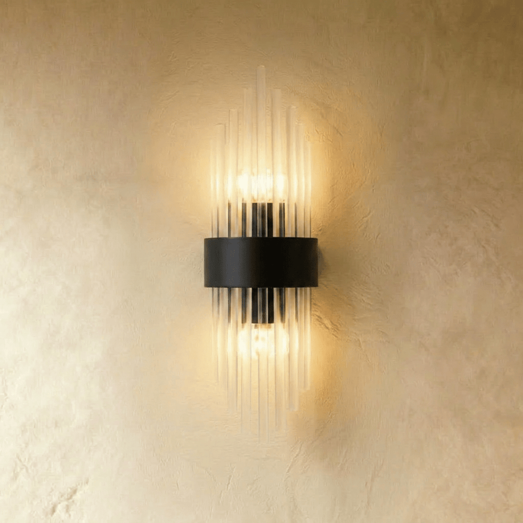 Clérachic black metal wall sconce with a compact spray of fluted glass rods around a curved backplate.