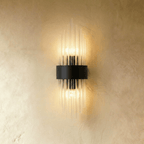 Clérachic black metal wall sconce with a compact spray of fluted glass rods around a curved backplate.