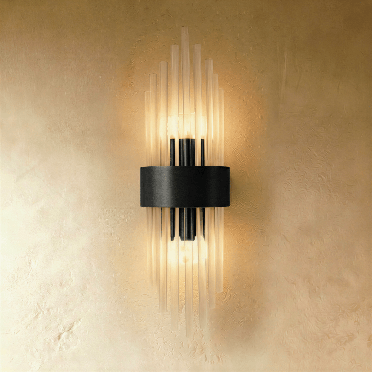 Clérachic black metal wall sconce with fluted glass rods radiating from a rectangular backplate against plaster.