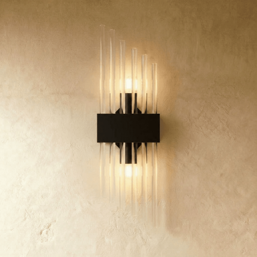 Clérachic black metal wall sconce with a shorter spray of fluted glass rods on a rectangular backplate.