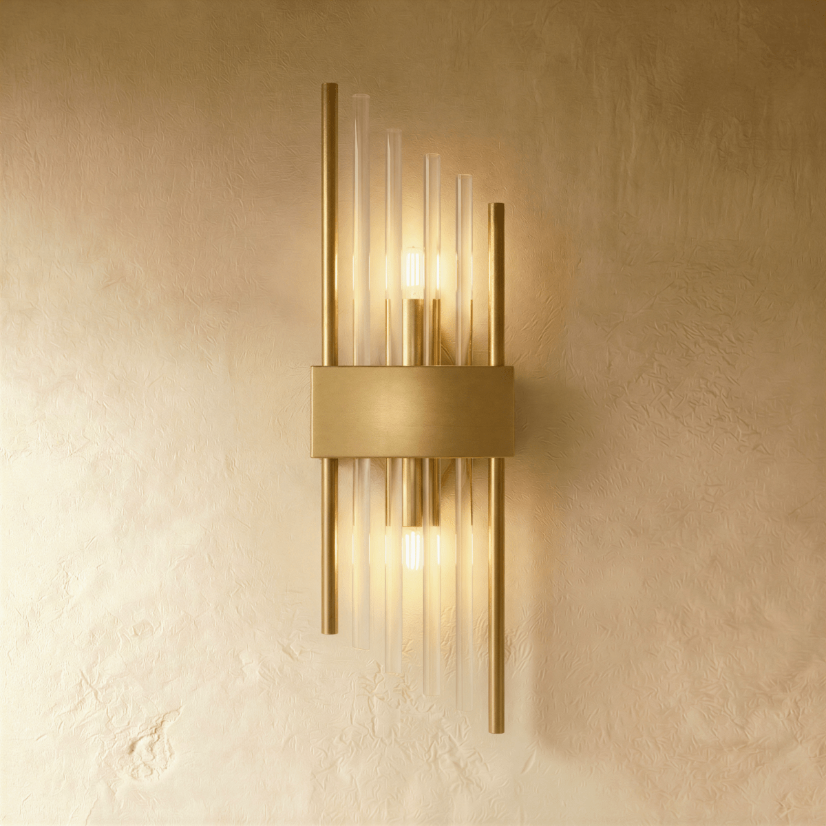 Clérachic brass wall sconce with long fluted glass rods and twin metal posts on a slim gold-tone backplate.