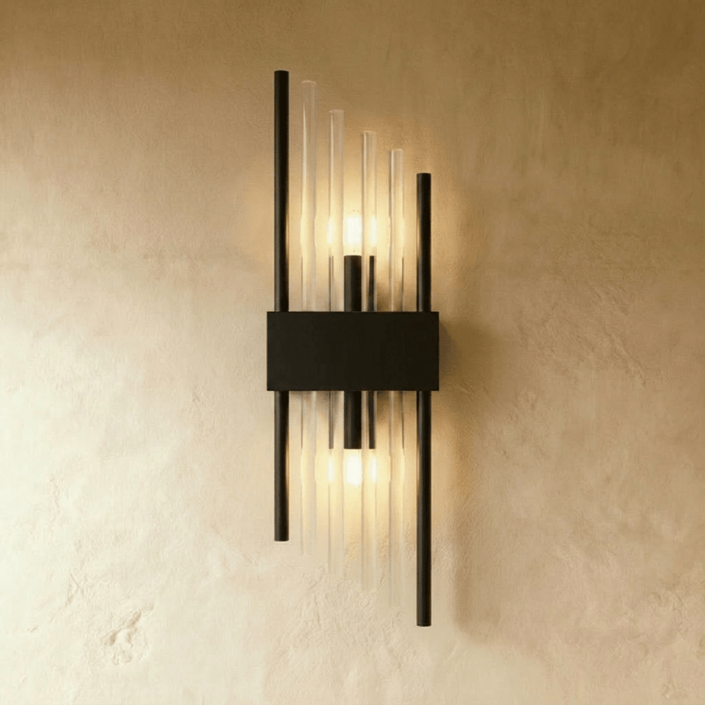 Clérachic black metal wall sconce with long fluted glass rods and twin metal posts on a slim backplate.