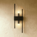 Clérachic black metal wall sconce with long fluted glass rods and twin metal posts on a slim backplate.