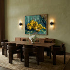 Clérachic black metal wall sconces flanking a framed painting above a walnut sideboard in a dining room.