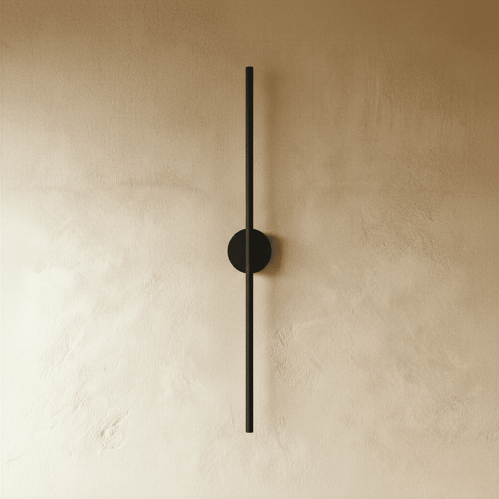 Clérachic black slim wall light shown unlit, a thin rod fixed by a round canopy to a plaster wall.