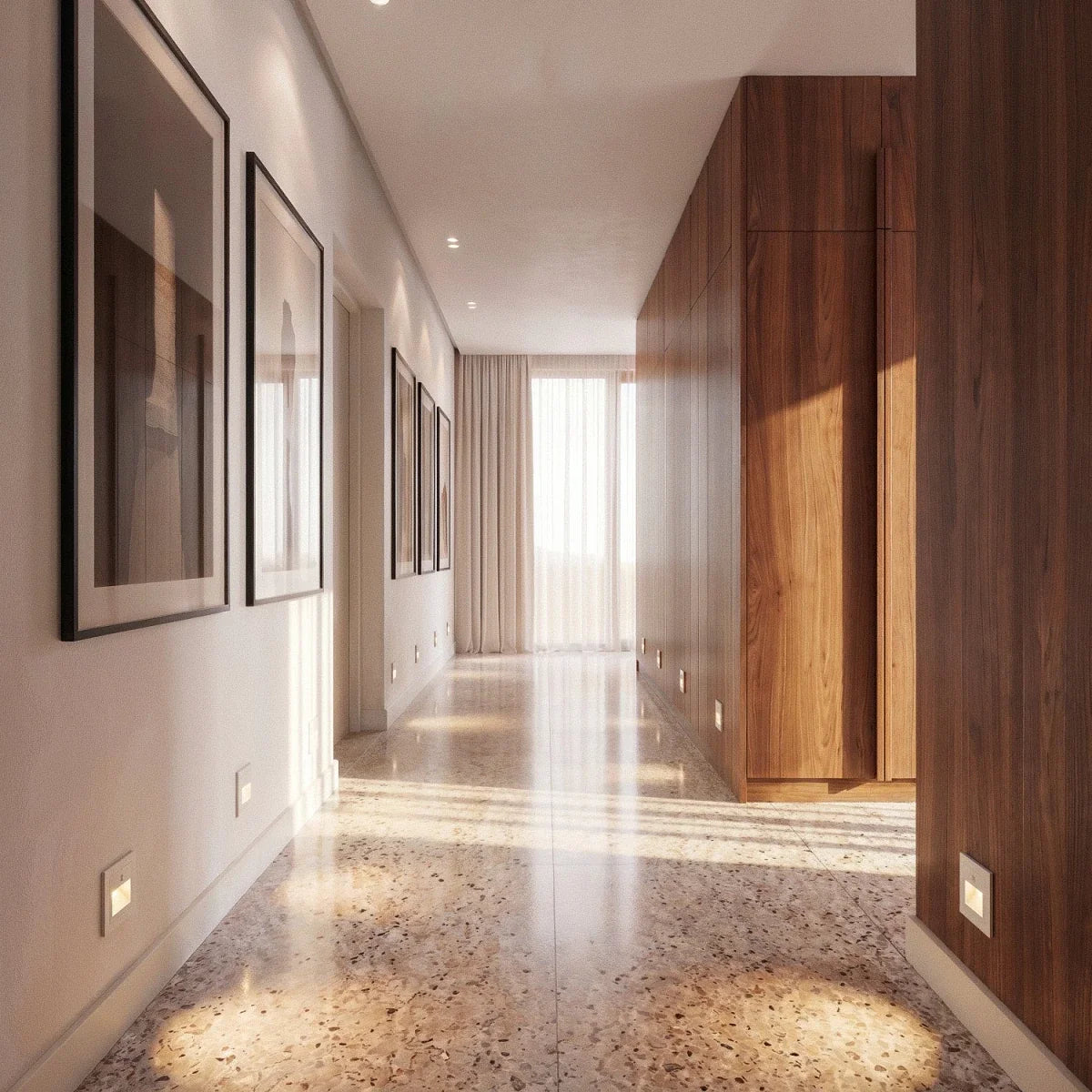 White recessed step lights run along a hallway baseboard past framed art and a polished terrazzo floor, Clérachic lifestyle shot.