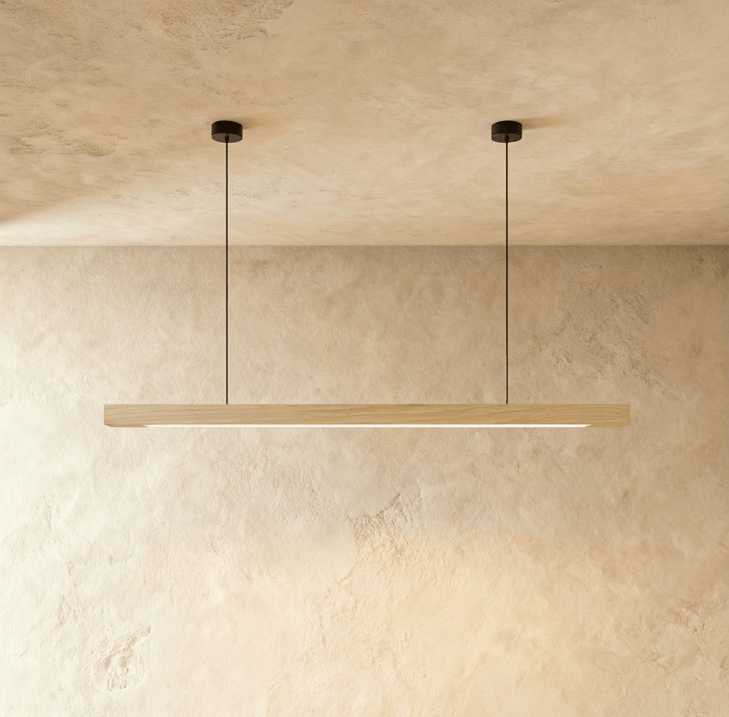 A straight-on view shows the Clérachic pine pendant bar lit from below, hung on two round canopies.