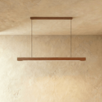 The Clérachic black walnut pendant bar hangs from a matching horizontal wood canopy on the ceiling.
