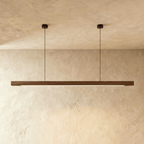 A front view of the Clérachic black walnut pendant bar shows its two round black ceiling canopies.