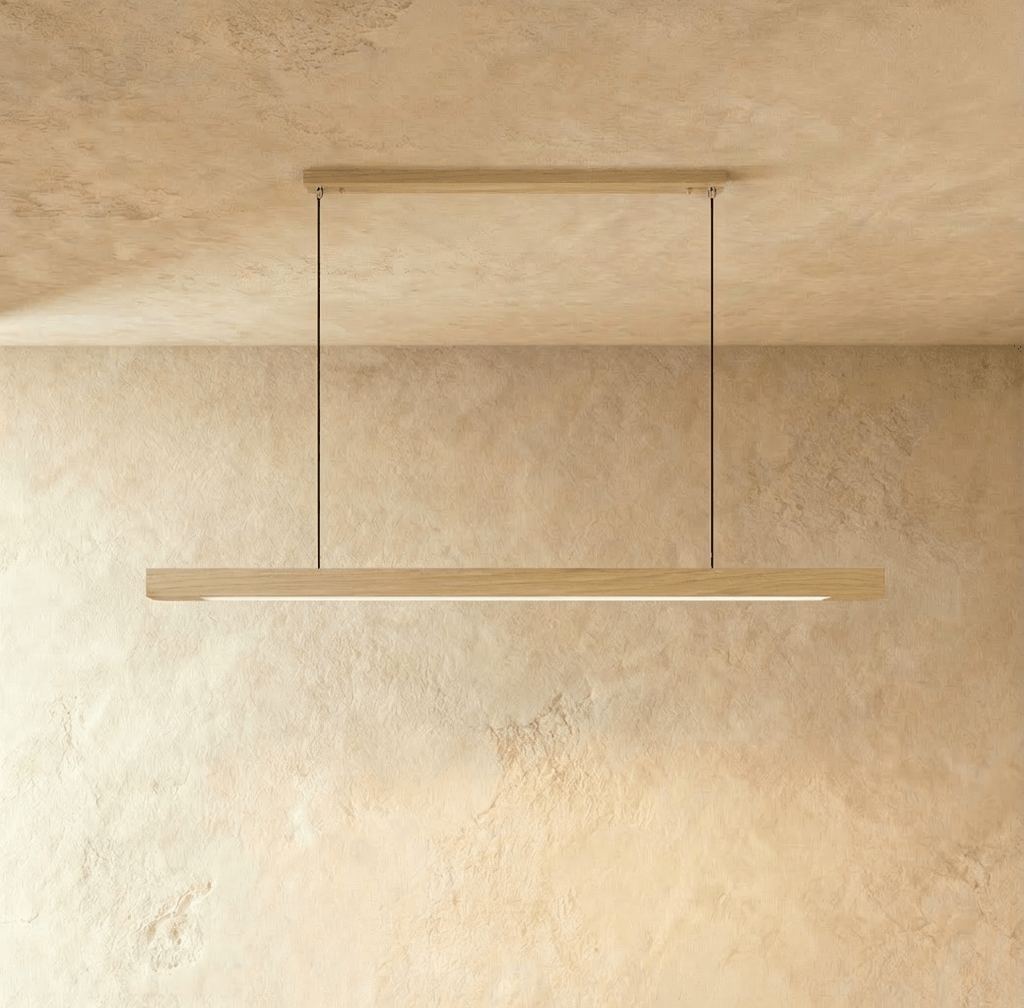 This Clérachic pine pendant bar hangs level from its horizontal wood canopy, lit softly along its edge.