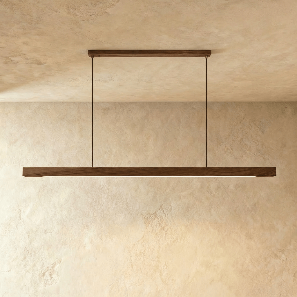The Clérachic black walnut pendant bar hangs level between two round black ceiling canopies here.