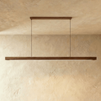 A close angle shows the Clérachic black walnut pendant bar's horizontal canopy and dark wood grain.
