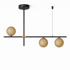 Clérachic 3-head linear chandelier with a black bar, brass collar and amber textured glass globes, shown unlit on white.