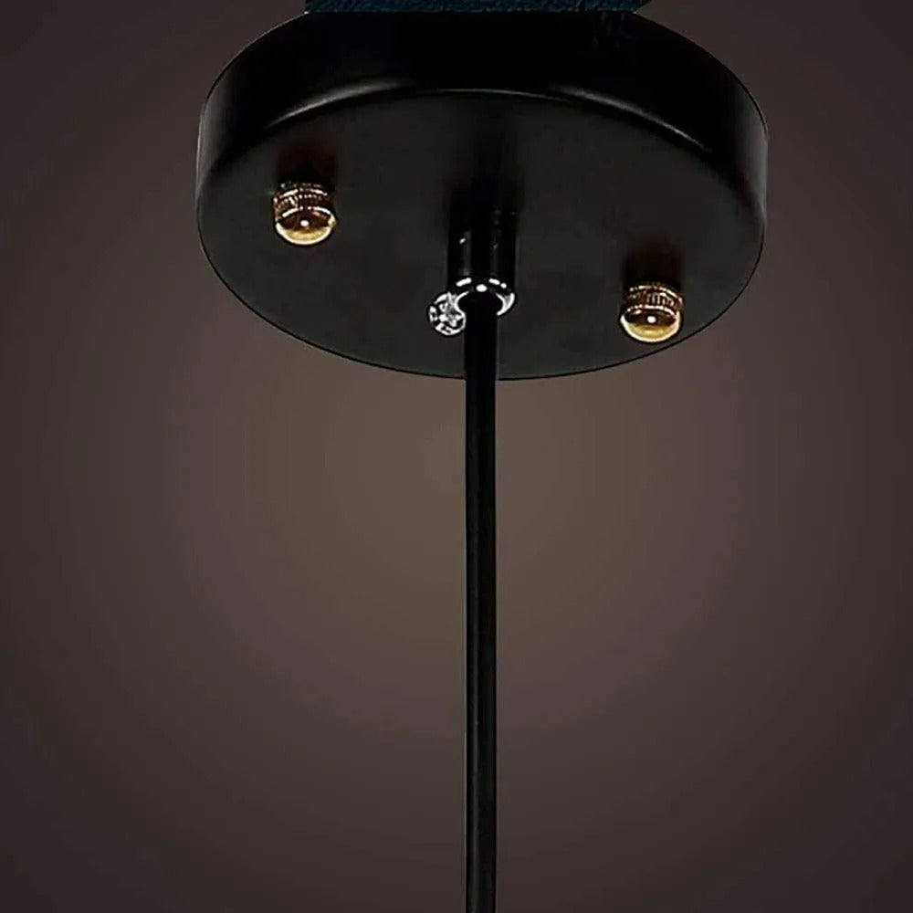Clérachic bottle pendant hanging low over a kitchen island