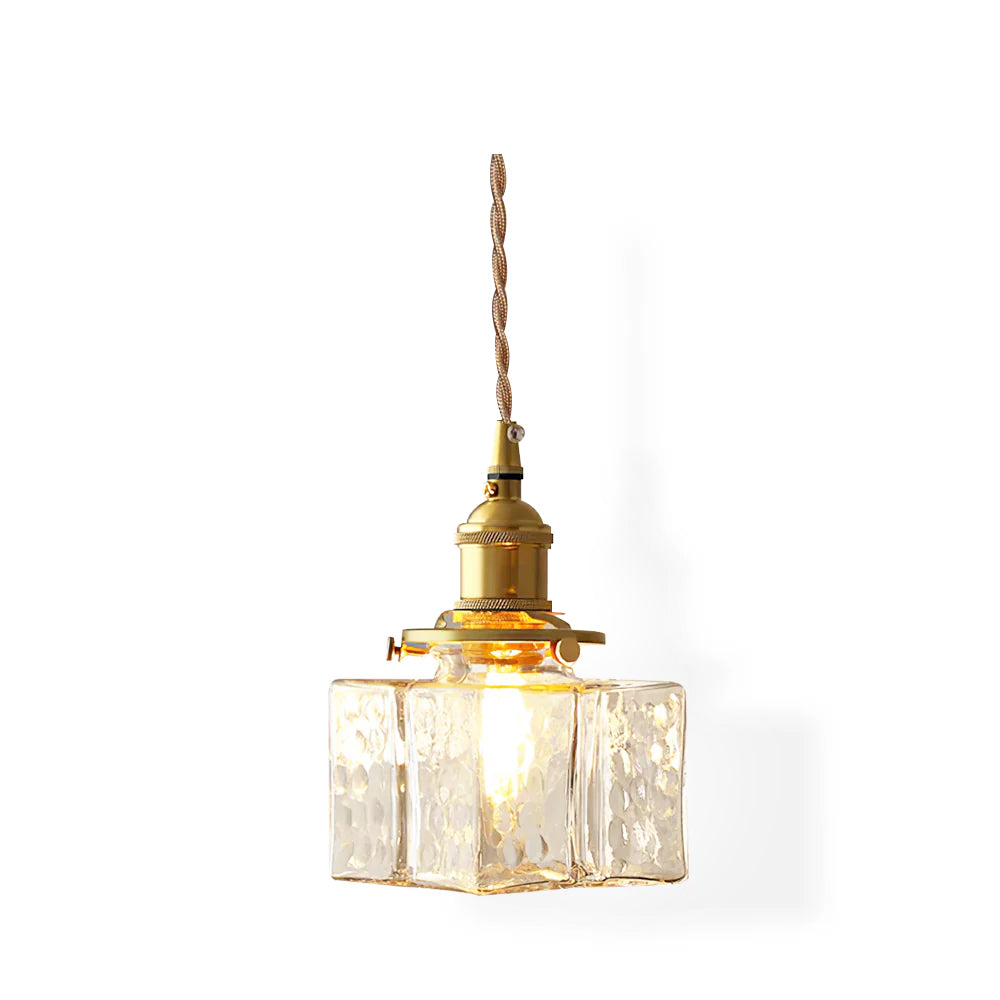 Studio shot of the lit Clérachic boxy hammered-glass pendant light in Model A size, showing the full cord drop on white.