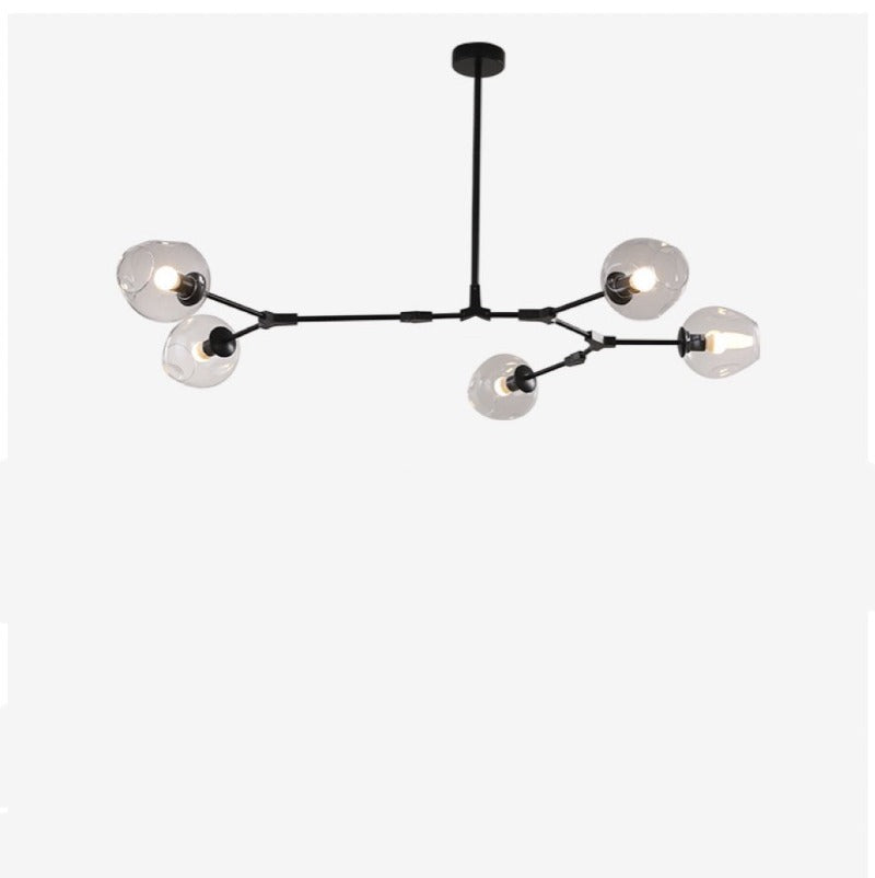 Studio view of the Clérachic chandelier: five gradient gray globes on cranked black arms branching from one rigid stem.