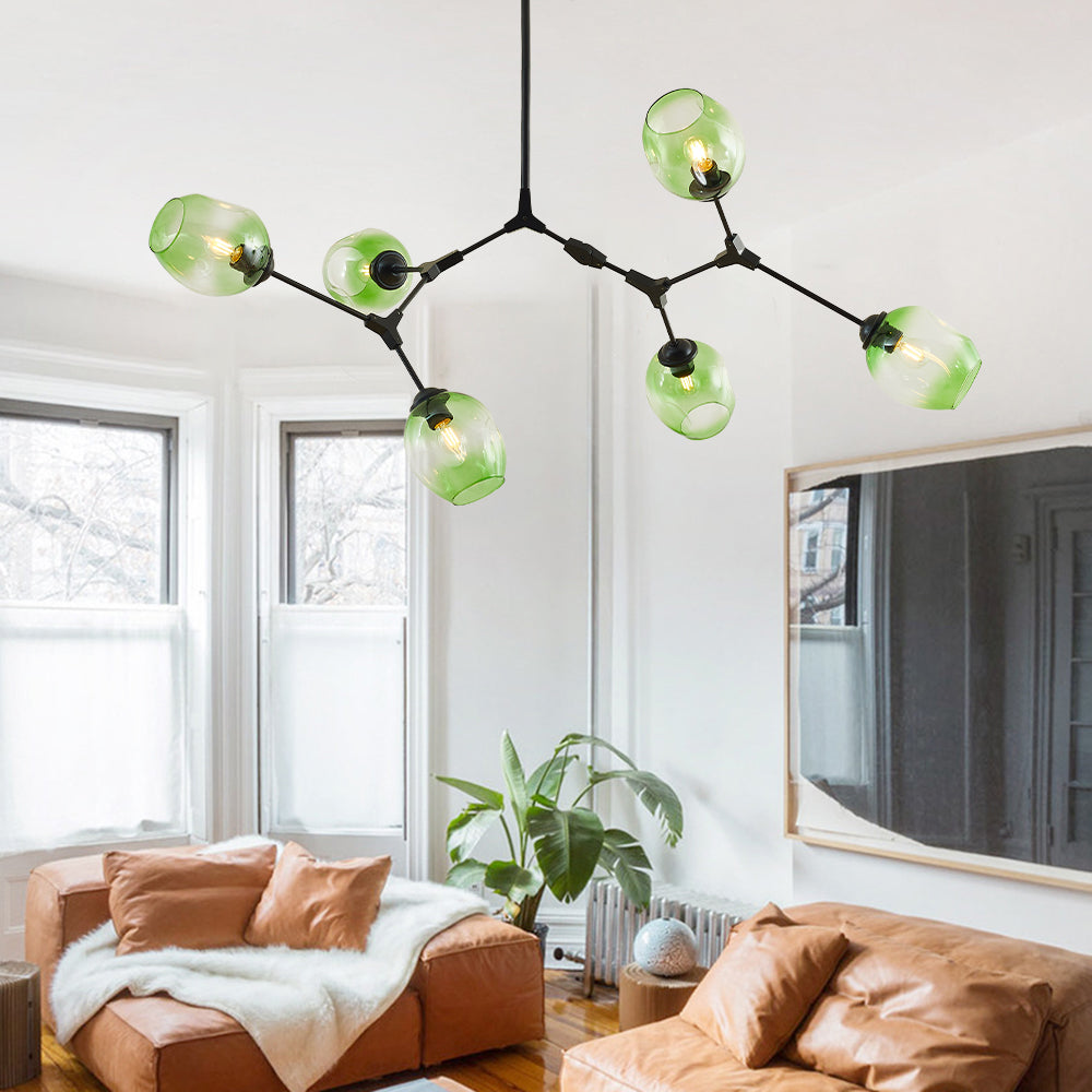 Six-head Clérachic chandelier in gradient green glass, its black arms reaching further across the same bay-window living room.