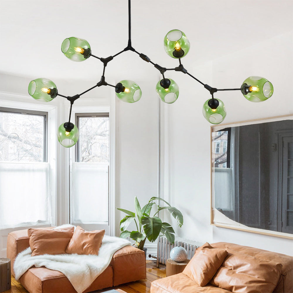 The eight-head Clérachic chandelier spreads gradient green globes wide across a white ceiling, each head cranked to its own angle.
