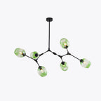 The six-head Clérachic chandelier in black with gradient green glass, photographed square-on against white.