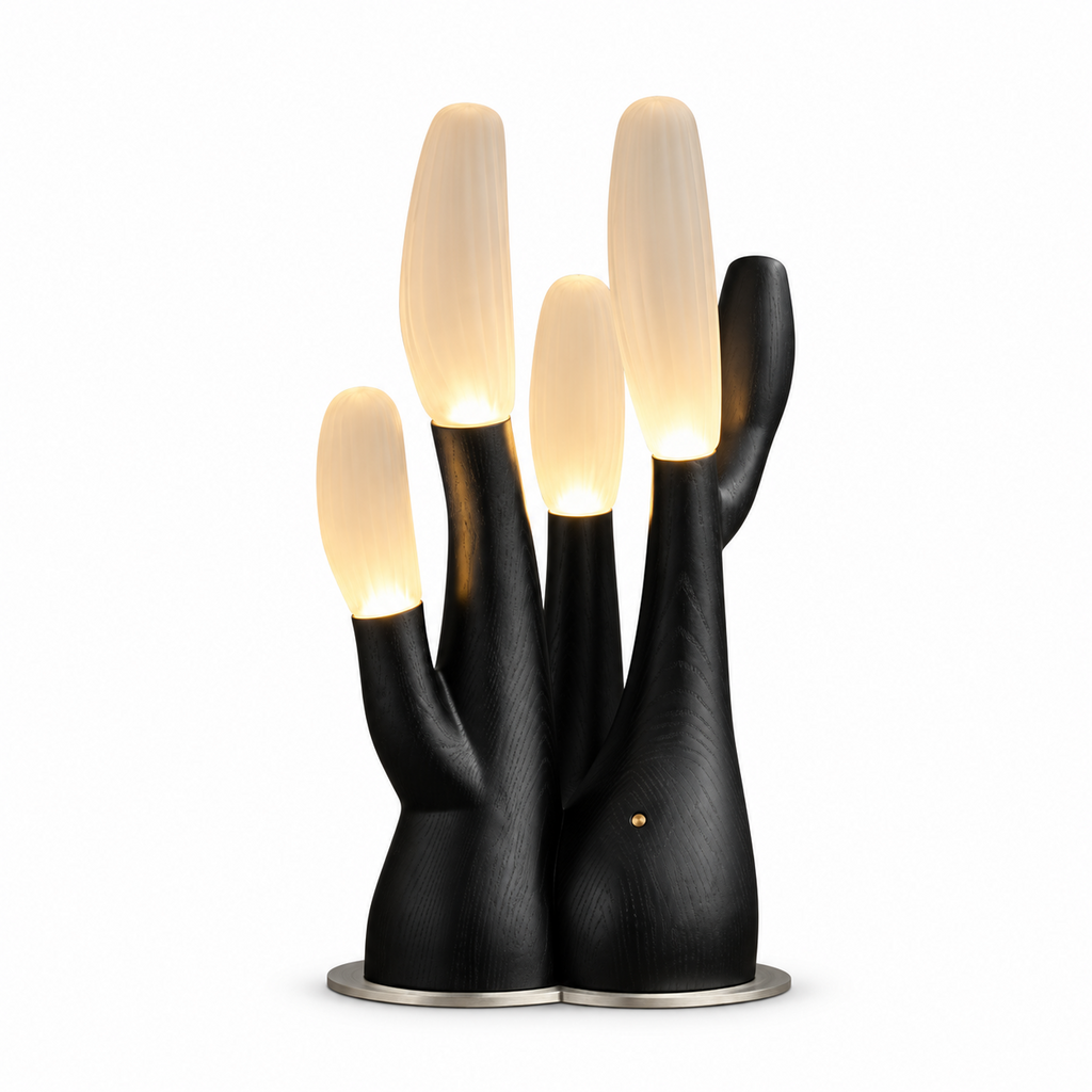 Cutout view of this Clérachic table lamp in black, its frosted glass branch tips lit against white.