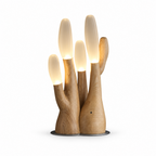 Another light-wood cutout of this Clérachic table lamp shows the full branching silhouette lit from within.
