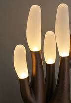 Close view of the frosted glass branch tips glowing on this dark-wood Clérachic table lamp.